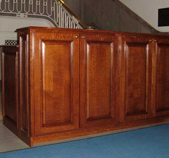 Raised-panel detail on the Naval Academy chapel cabinets, dyed and stained to match the original woodwork