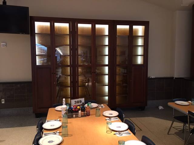 Nine-foot-tall cherry display cabinets built for King Hall at the US Naval Academy, made to display plates signed by visiting dignitaries